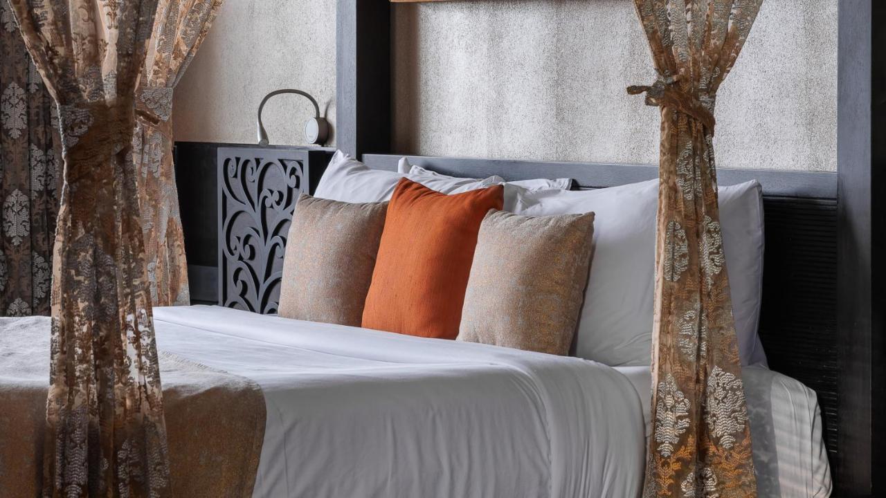 The Panoramic Getaway Hotel Munnar Bagian luar foto A bed with cushions