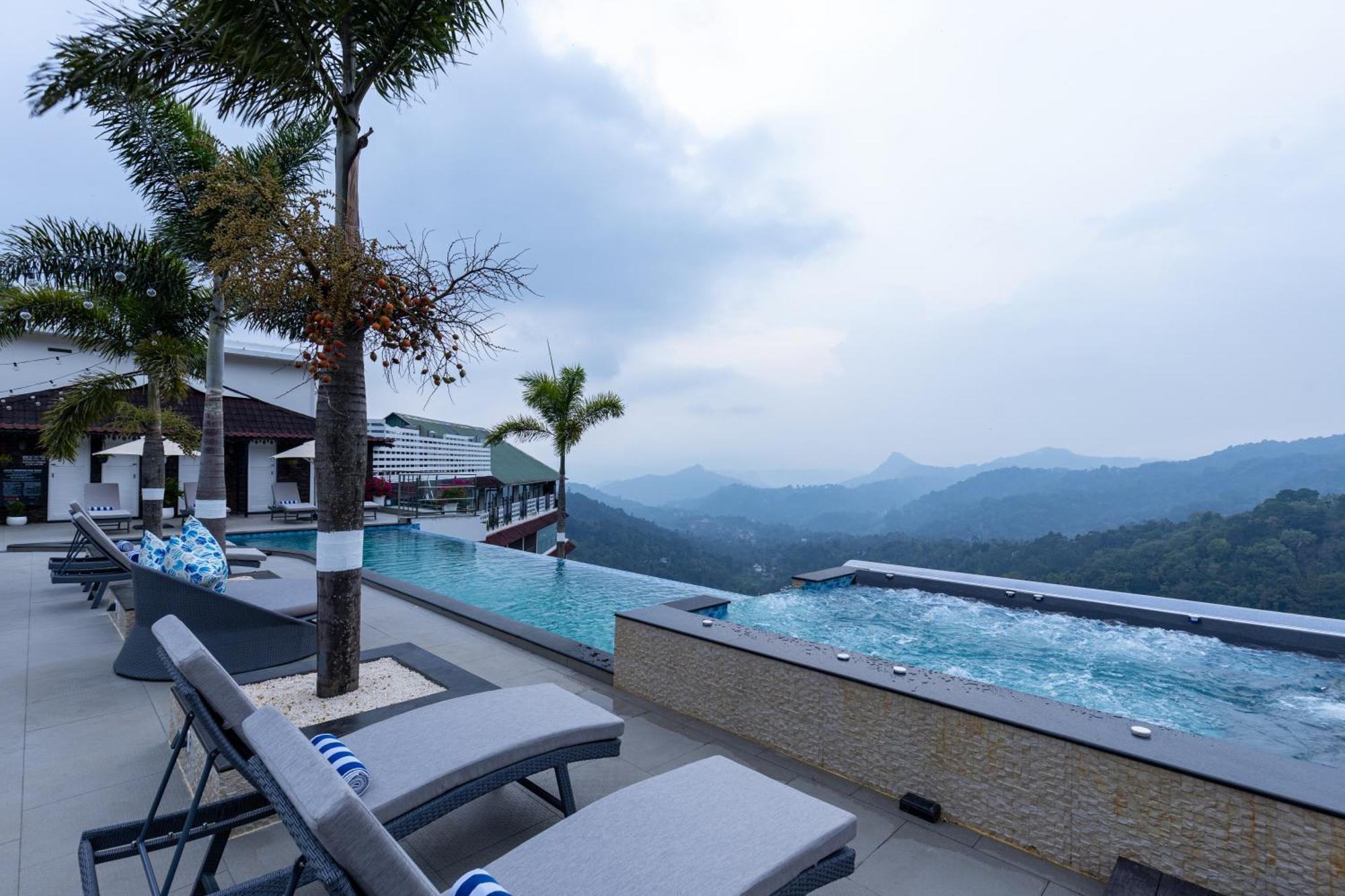 The Panoramic Getaway Hotel Munnar Bagian luar foto The swimming pool at the resort
